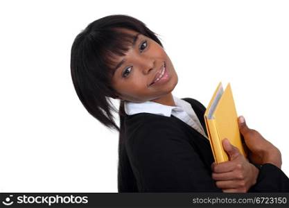 Businesswoman hugging a folder to her chest