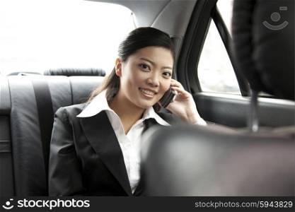 Businesswoman in a car on the phone