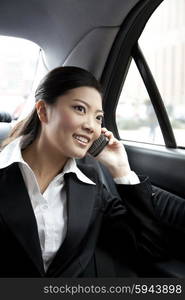 Businesswoman in a car on the phone