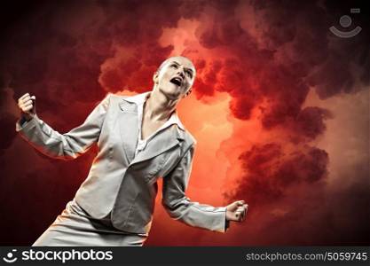 businesswoman in anger. businesswoman in anger screaming against cloudy background