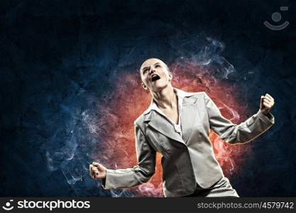 businesswoman in anger. businesswoman in anger screaming against dark blue background