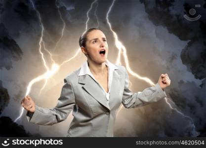 businesswoman in anger. businesswoman in anger screaming against lightning background