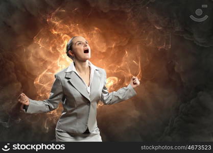 businesswoman in anger. businesswoman in anger screaming against smoky background