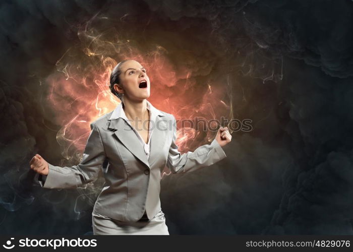 businesswoman in anger. businesswoman in anger screaming against smoky background