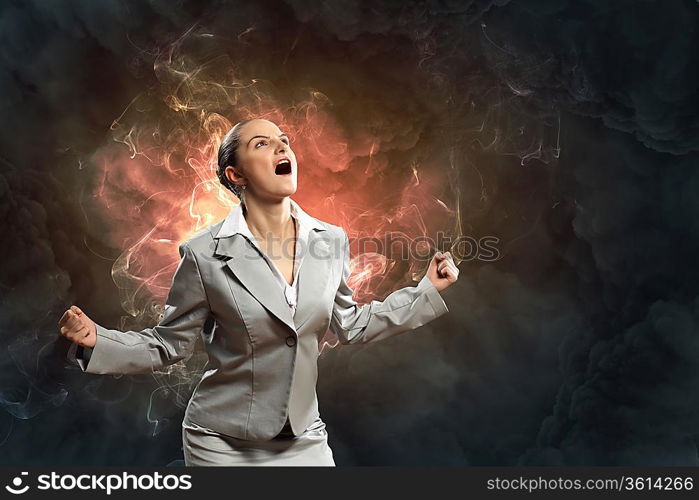 businesswoman in anger screaming against smoky background