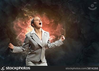 businesswoman in anger screaming against smoky background