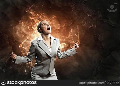 businesswoman in anger screaming against smoky background