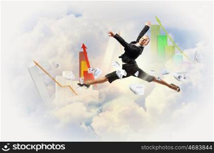 businesswoman in black suit jumping. pretty businesswoman jumping high against diagram background