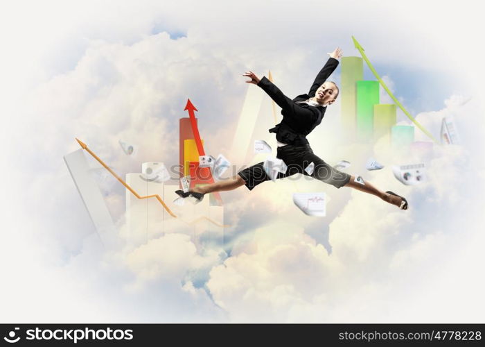 businesswoman in black suit jumping. pretty businesswoman jumping high against diagram background