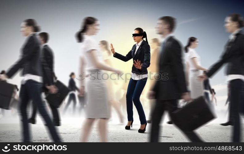 Businesswoman in blindfold among group of people. Image of businesswoman in blindfold walking among group of people