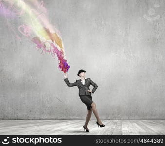 Businesswoman in bowler hat. Creative businesswoman in suit and hat with paints splash