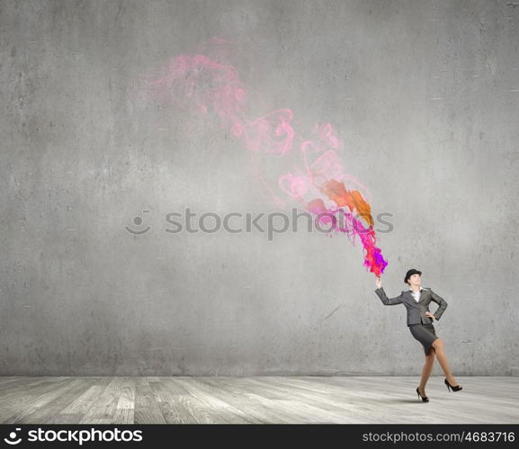 Businesswoman in bowler hat. Creative businesswoman in suit and hat with paints splash