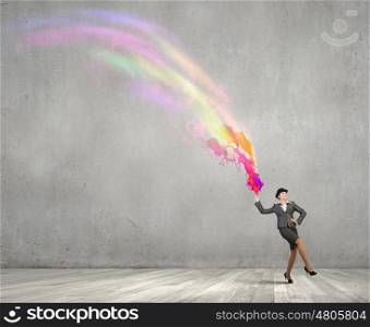Businesswoman in bowler hat. Creative businesswoman in suit and hat with paints splash