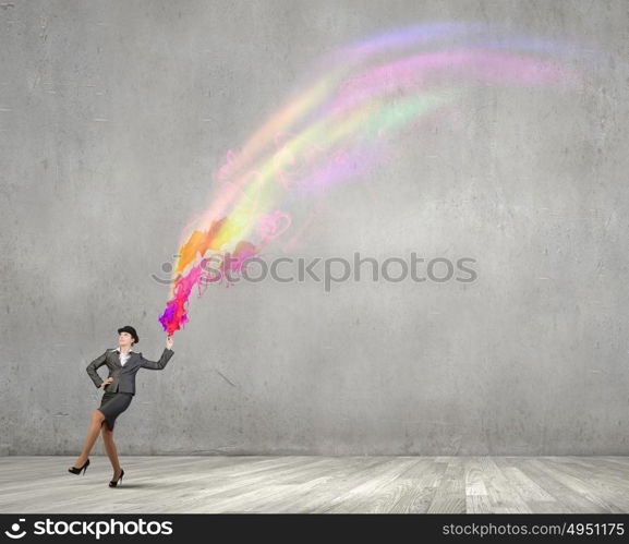 Businesswoman in bowler hat. Creative businesswoman in suit and hat with paints splash