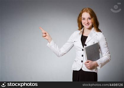 Businesswoman in business concept with book