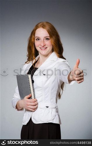 Businesswoman in business concept with book
