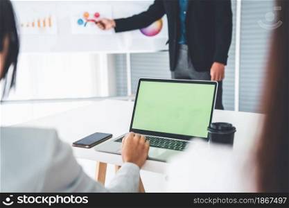 Businesswoman in business meeting using computer proficiently at office room . Corporate business team collaboration concept .. Businesswoman in business meeting using computer proficiently at office room .