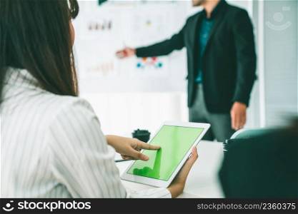 Businesswoman in business meeting using computer proficiently at office room . Corporate business team collaboration concept .. Businesswoman in business meeting using computer proficiently at office room .