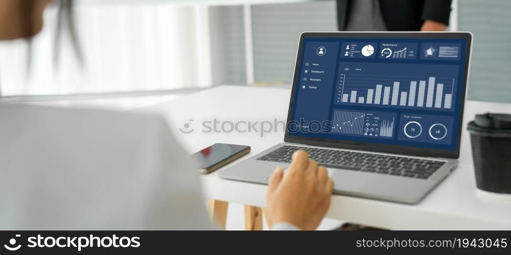 Businesswoman in business meeting using laptop computer proficiently at office for marketing data analysis . Corporate business team collaboration concept .. Businesswoman in business meeting using laptop computer proficiently at office