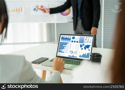Businesswoman in business meeting using laptop computer proficiently at office for marketing data analysis . Corporate business team collaboration concept .. Businesswoman in business meeting using laptop computer proficiently at office