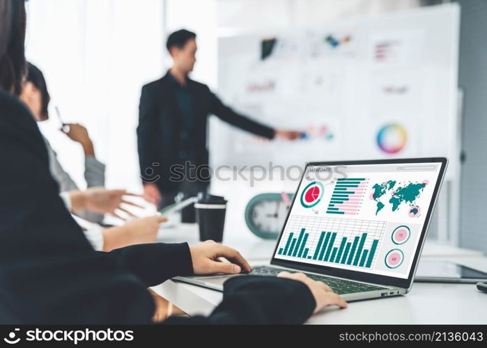 Businesswoman in business meeting using laptop computer proficiently at office for marketing data analysis . Corporate business team collaboration concept .. Businesswoman in business meeting using laptop computer proficiently at office