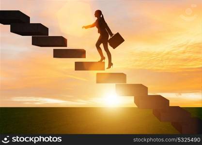 Businesswoman in career growth concept with stairs