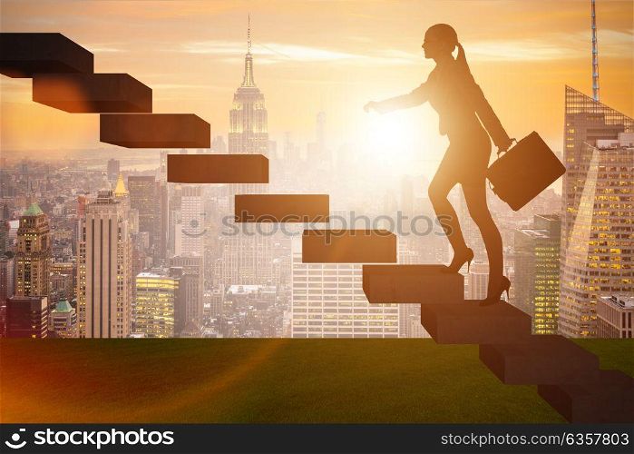 Businesswoman in career growth concept with stairs