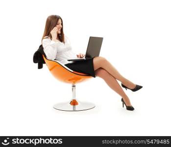 businesswoman in chair with laptop and phone over white