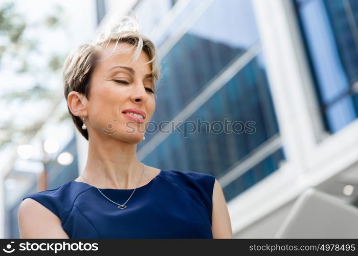 Businesswoman in city holding his notebook. Technology is a part of my life