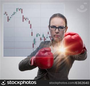 Businesswoman in competition concept with boxing