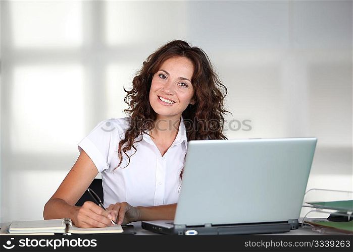 Businesswoman in front of computer in the office