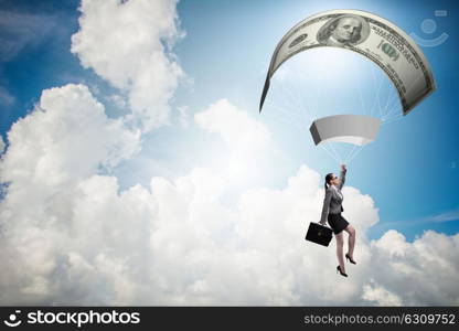 Businesswoman in golden parachute concept