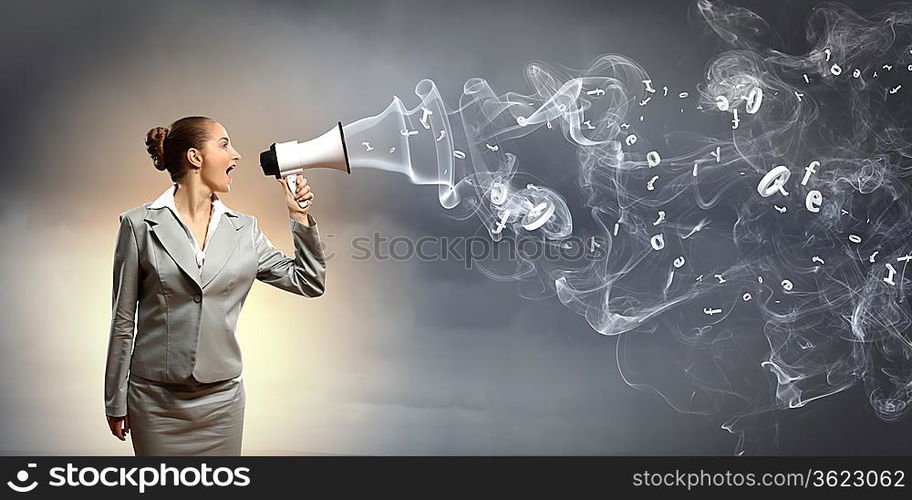 businesswoman in grey suit screaming into megaphone