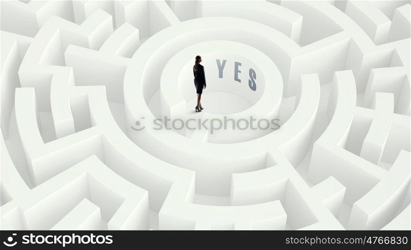 Businesswoman in labyrinth center Mixed media. Puzzled young businesswoman standing in white labyrinth