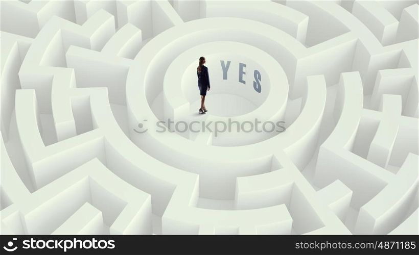 Businesswoman in labyrinth center Mixed media. Puzzled young businesswoman standing in white labyrinth