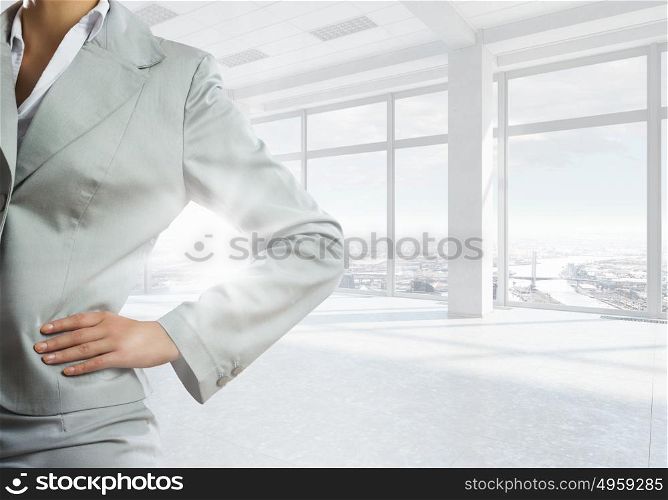 Businesswoman in office mixed media. Young successful businesswoman in white office interior close view