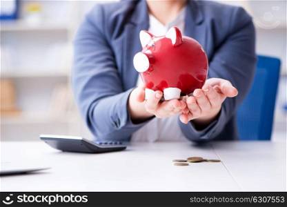 Businesswoman in pension savings concept. The businesswoman in pension savings concept