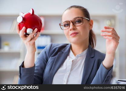 Businesswoman in pension savings concept. The businesswoman in pension savings concept