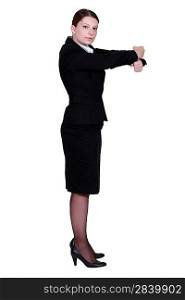 businesswoman in profile making gesture with fists