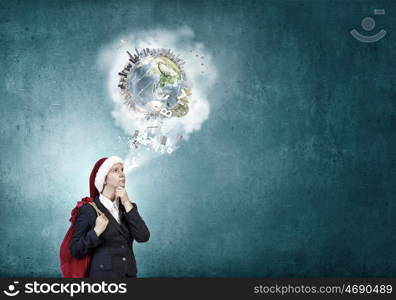 Businesswoman in Santa hat. Santa woman running with red gift bag on back. Elements of this image are furnished by NASA