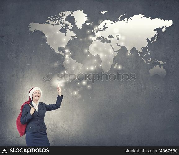 Businesswoman in Santa hat. Santa woman running with red gift bag on back