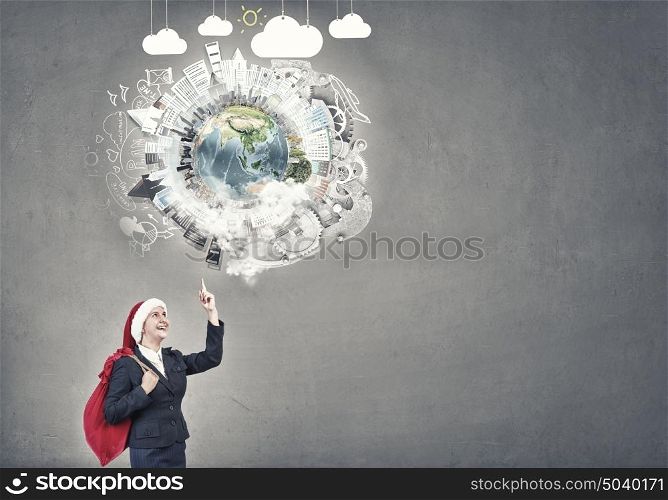 Businesswoman in Santa hat. Santa woman running with red gift bag on back. Elements of this image are furnished by NASA