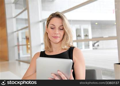 Businesswoman in the office working on electronic tab
