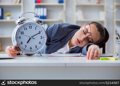 Businesswoman in time management concept sleeping