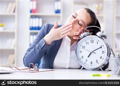 Businesswoman in time management concept sleeping