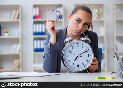 Businesswoman in time management concept. The businesswoman in time management concept