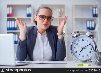 Businesswoman in time management concept . The businesswoman in time management concept