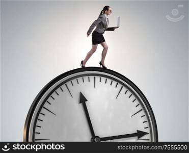 Businesswoman in time management concept. The businesswoman in time management concept