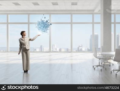 Businesswoman in top floor office. Elegant businesswoman in modern office interior against window panoramic view