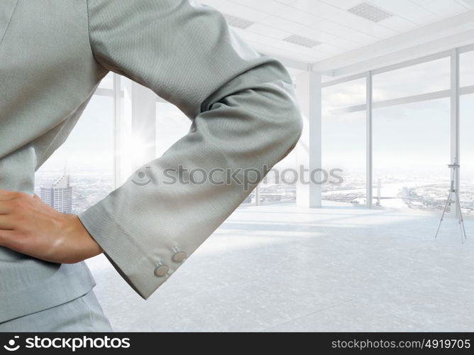 Businesswoman in top floor office. Elegant businesswoman in modern office interior against window panoramic view